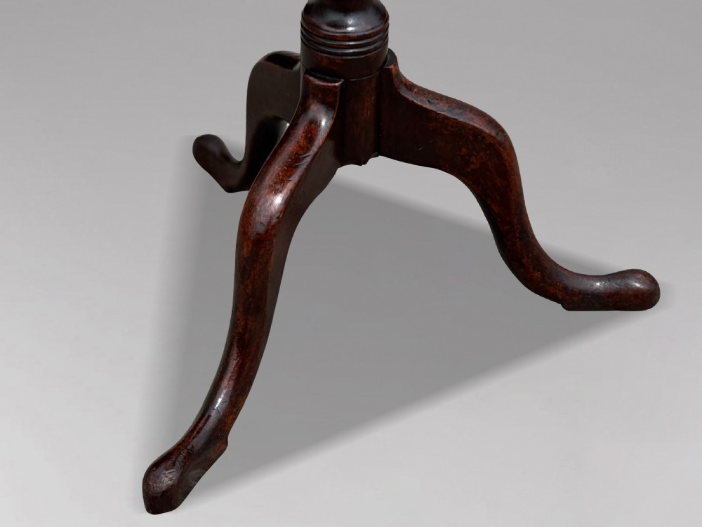 An 18th-century George III mahogany tripod table featuring an octagonal top, a central turned column, and three cabriole legs. View III