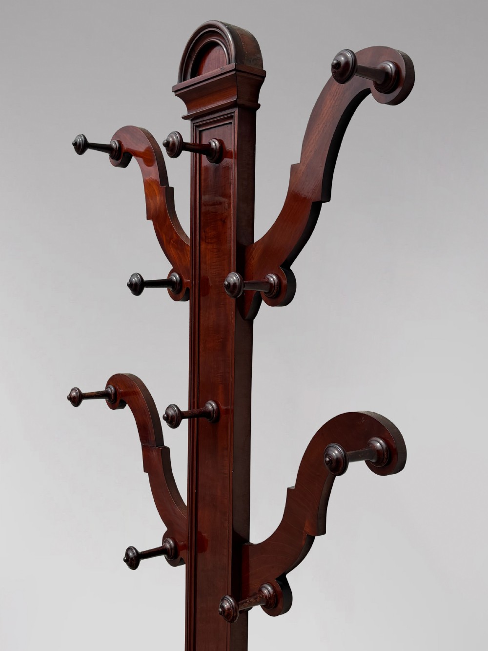 A 19th-century Victorian mahogany hall stand with carved coat pegs, turned supports, and an umbrella base featuring a green drip tray. View III