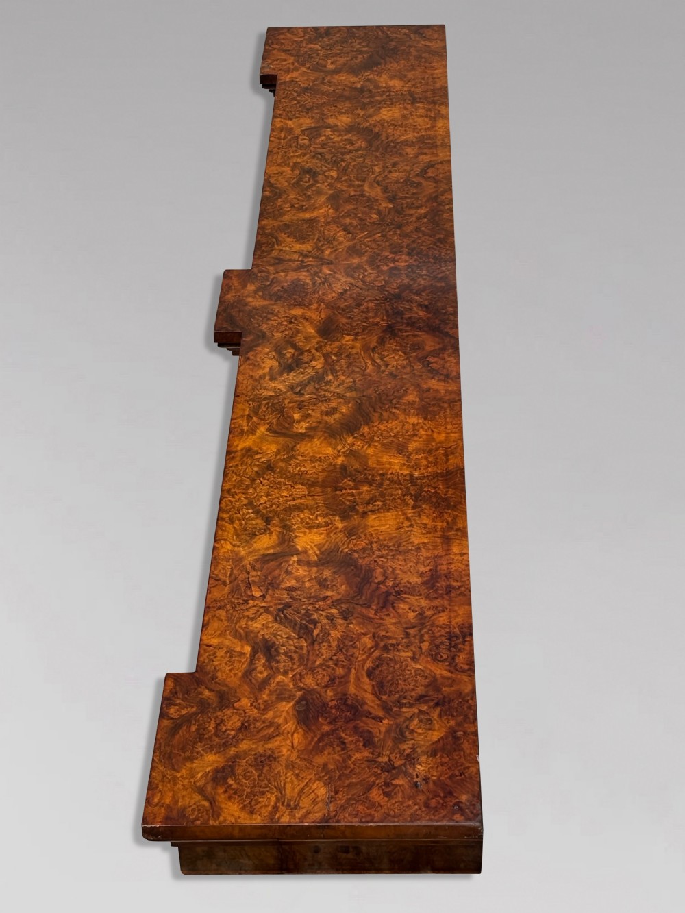 A low 19th-century William IV open bookcase crafted from burr walnut with two shelf sections flanked by carved pilasters. View VI