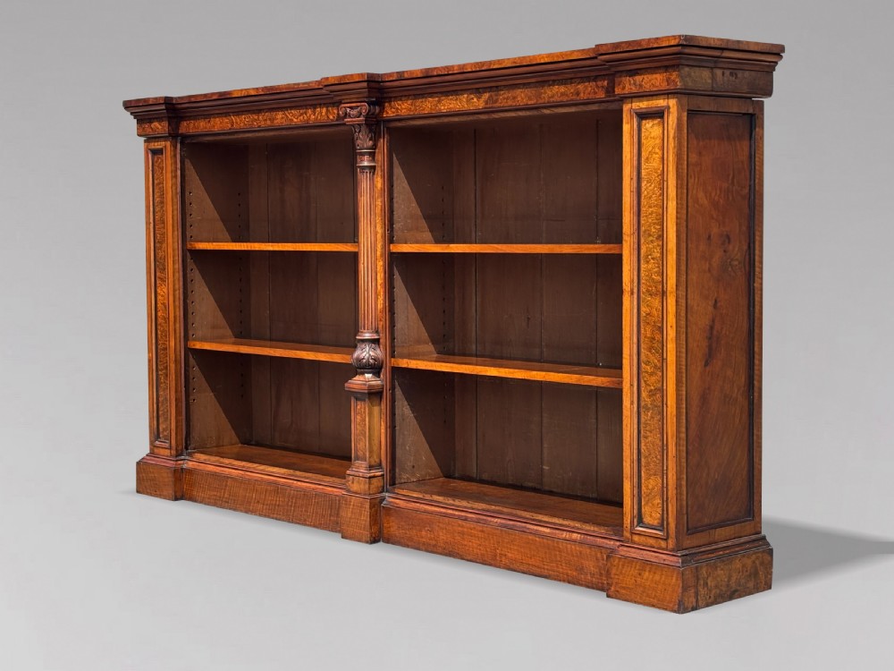 A low 19th-century William IV open bookcase crafted from burr walnut with two shelf sections flanked by carved pilasters. View VIII