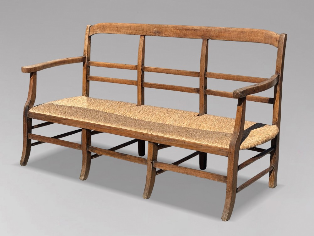19TH CENTURY FRENCH WALNUT RUSH SEAT HALL BENCH, C1850