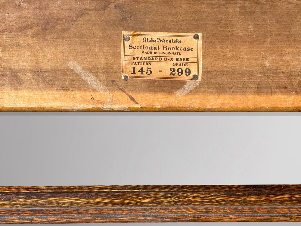 A tall late 19th-century six-tier oak Globe Wernicke bookcase with glazed up-and-over doors. View VIII