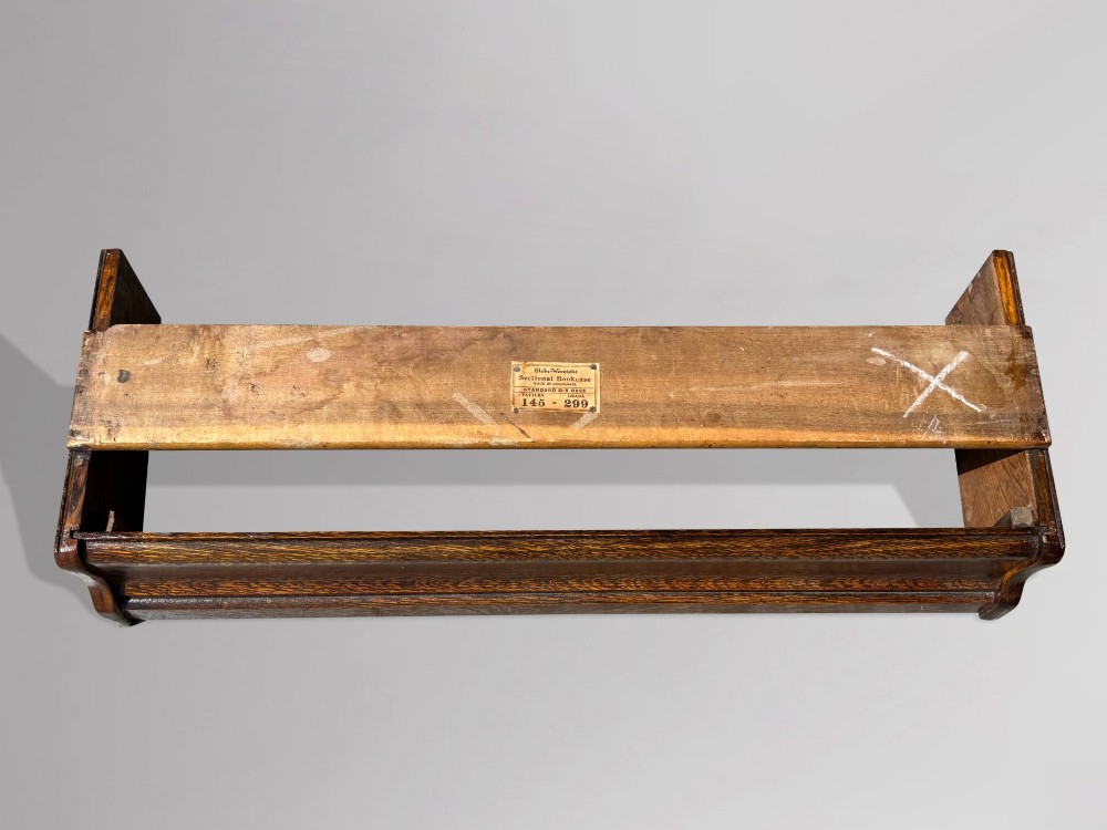 A tall late 19th-century six-tier oak Globe Wernicke bookcase with glazed up-and-over doors. View IX