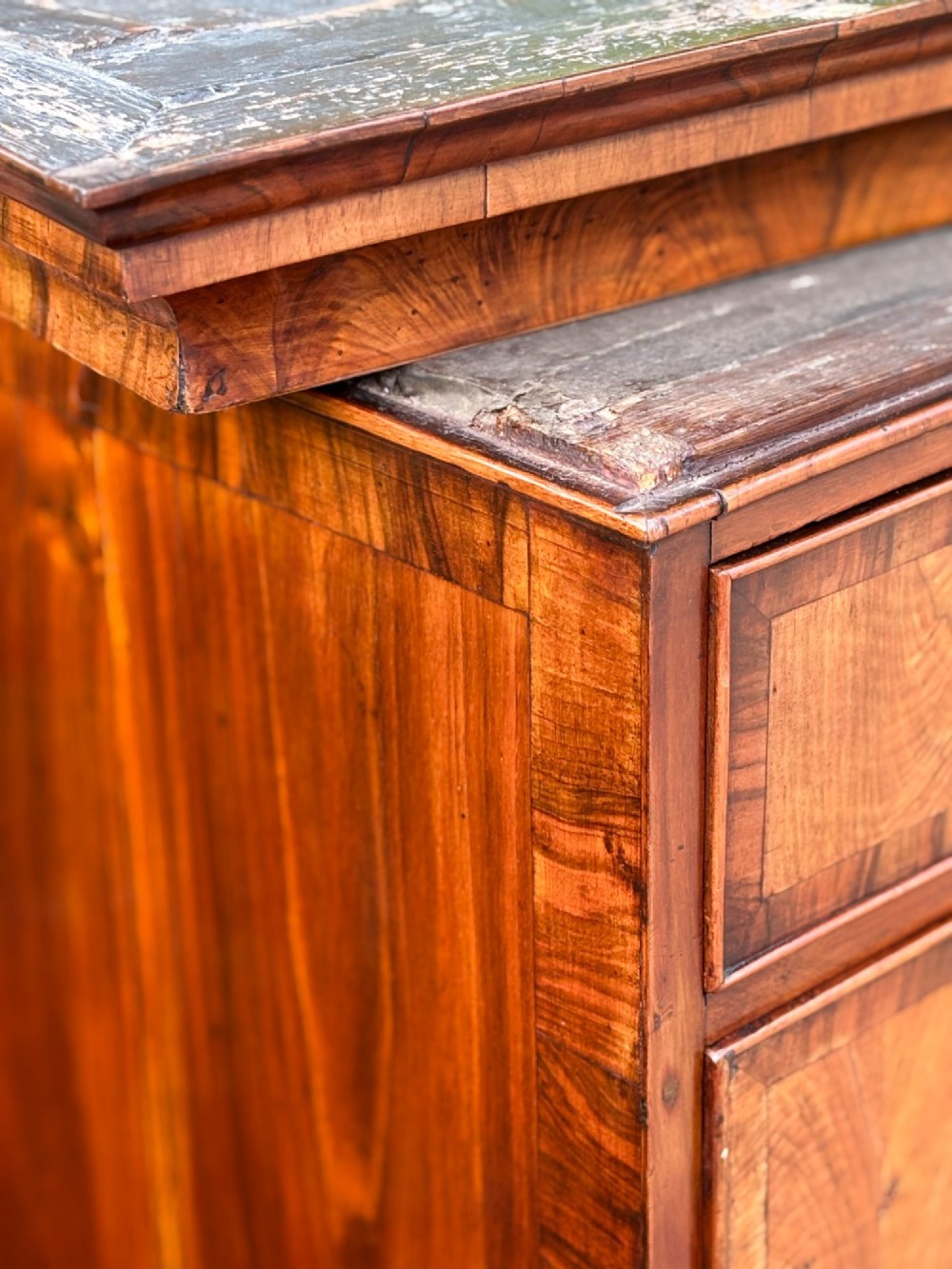 An eighteenth-century George II walnut chest on chest featuring two short over six long graduated drawers with decorative brass handles, keyhole escutcheons, and bracket feet. View VI