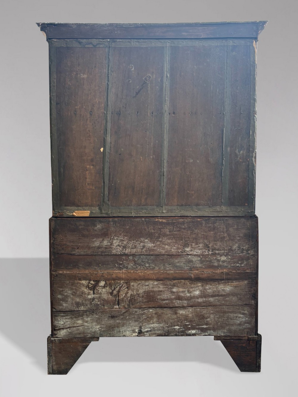 An eighteenth-century George II walnut chest on chest featuring two short over six long graduated drawers with decorative brass handles, keyhole escutcheons, and bracket feet. View VII