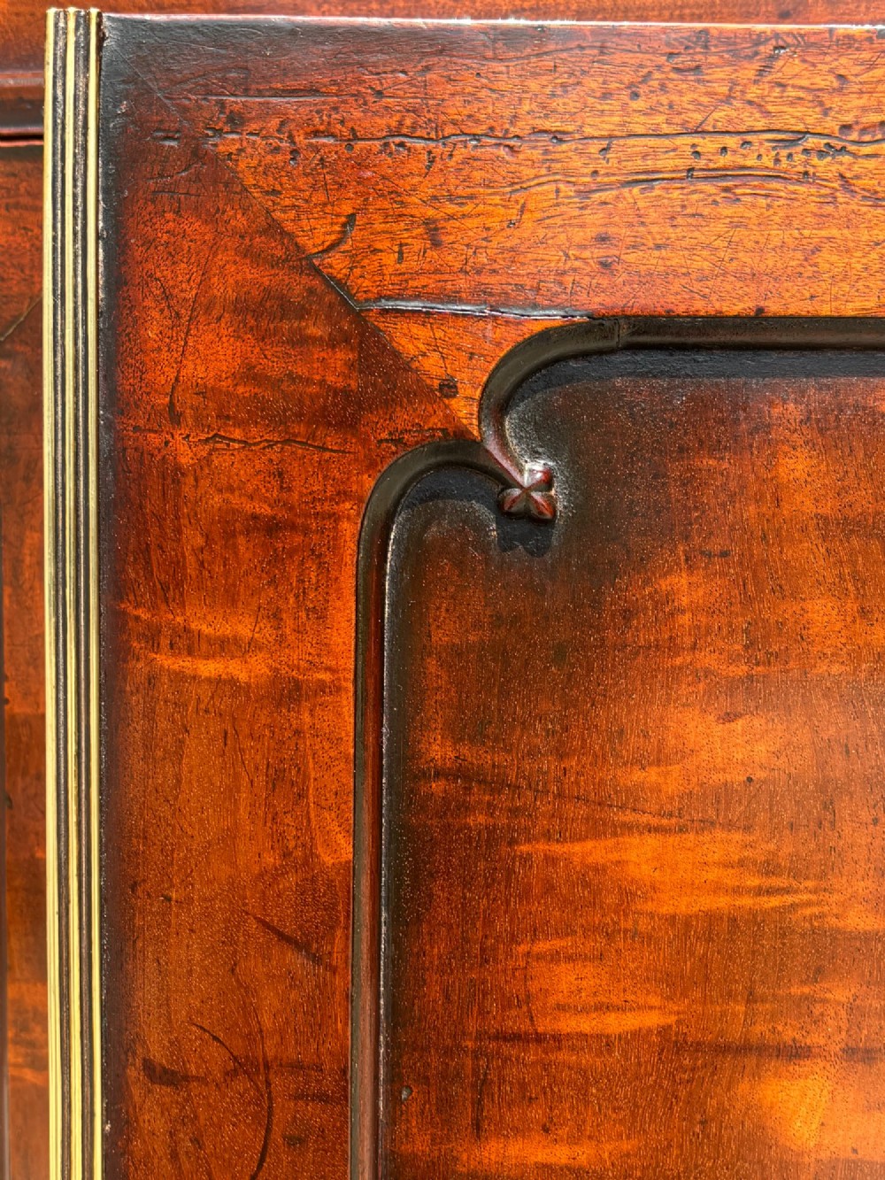 An eighteenth-century George III tall mahogany bookcase featuring two upper astragal glazed doors, lower flame-veneered cabinet doors, and a moulded cornice. View X