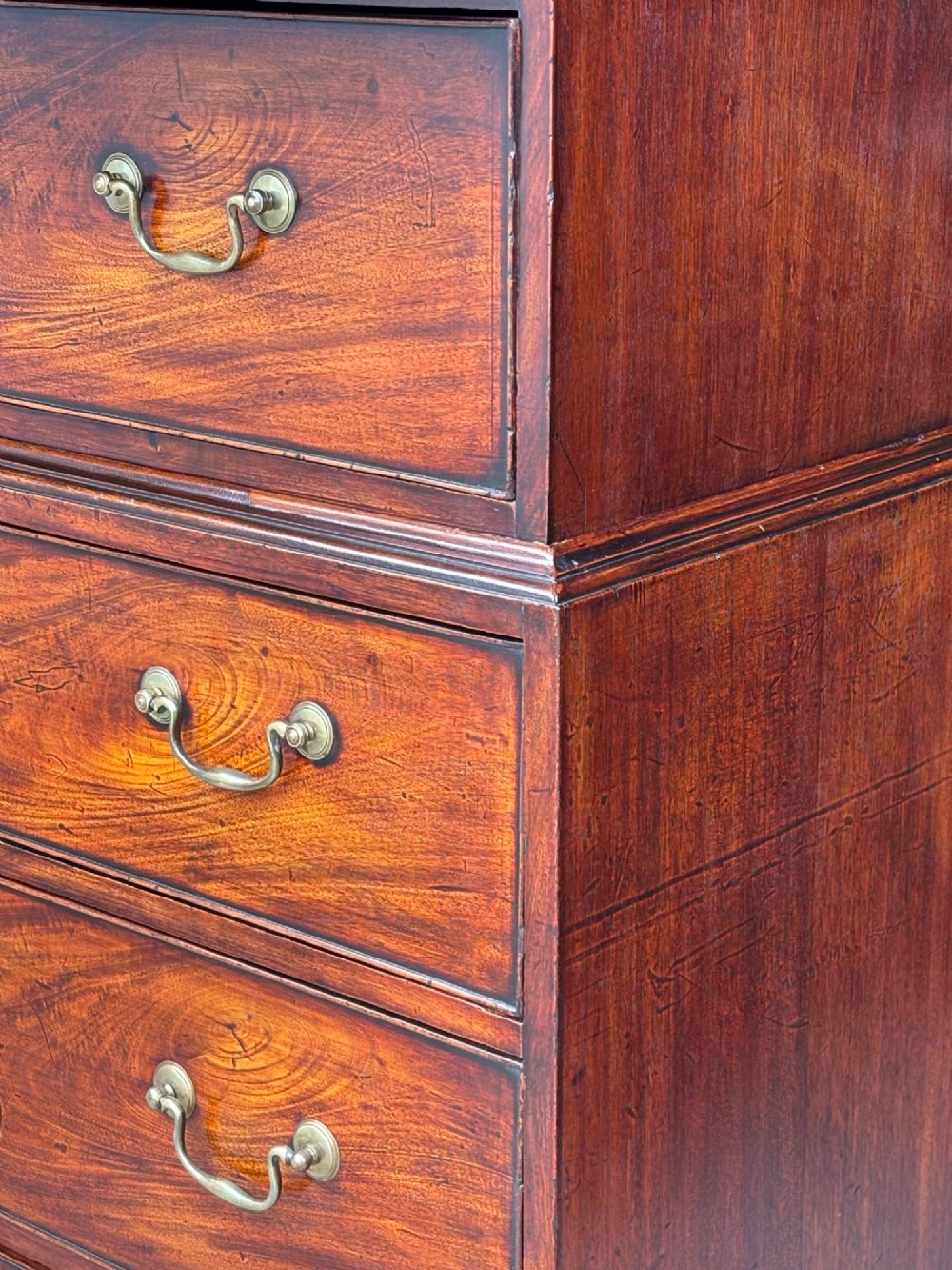 An 18th-century George III mahogany chest on chest featuring upper and lower drawer sections with brass handles and bracket feet. View XI