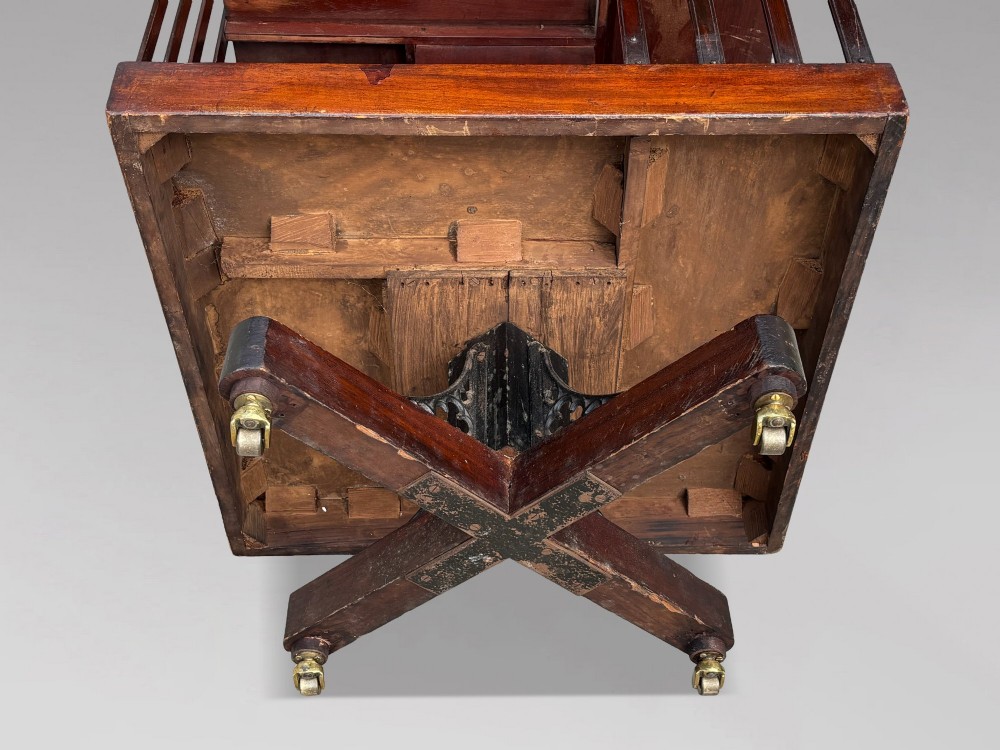 A four-tier Victorian mahogany revolving bookcase featuring vertical slatted sides, a square top, and a rotating base on brass castors. View VI