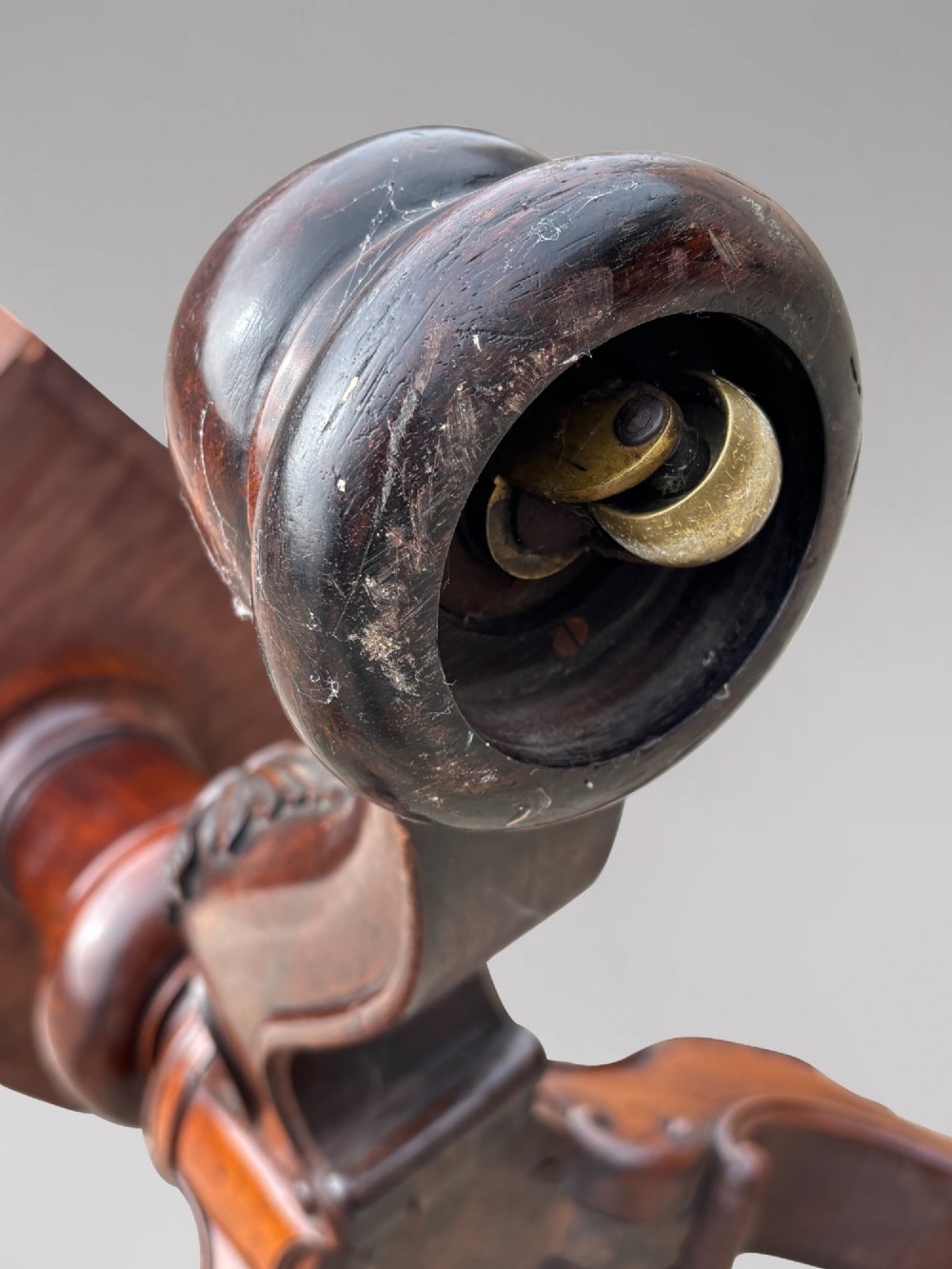 A circular William IV period rosewood centre table with a figured top on a carved pedestal and tripod base. View VII
