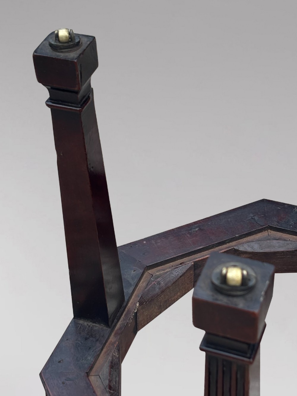 An eighteenth-century octagonal mahogany wine cooler featuring brass side handles, a keyhole detail, boxwood inlay, and fluted legs on castors. View IX