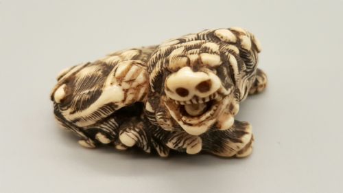 superb japanese edo ivory netsuke of a karashishi with a ball in his mouth - CATEGORY: ANTIQUE MISCELLANEOUS - DATED 19TH CENTURY