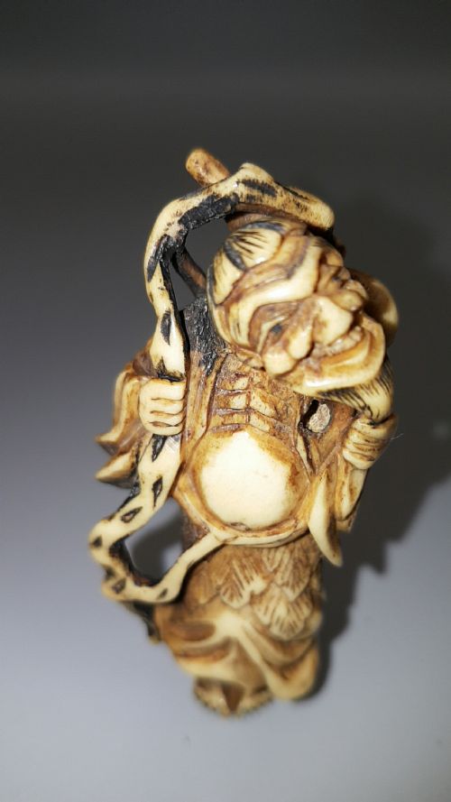 japanese meiji 19thc stag antler netsuke of chokwaro sennin with staff and gourd - CATEGORY: ANTIQUE MISCELLANEOUS - DATED 19TH CENTURY