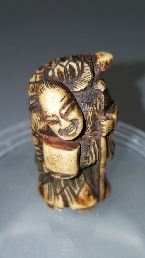 Rare Japanese Edo (19thc) Stag Antler Netsuke of a Hermit (Sennin) Carrying a Tortoise