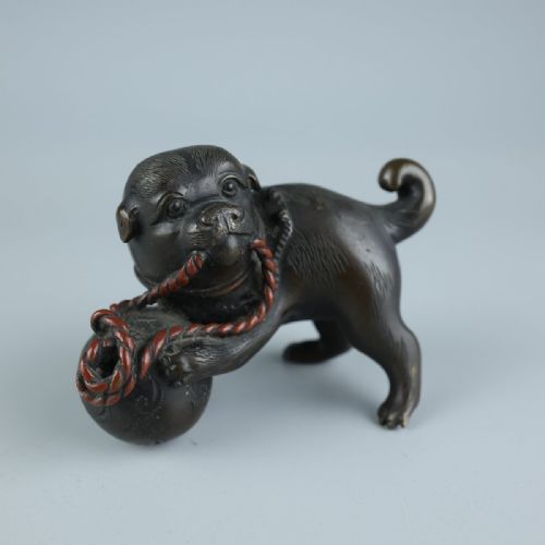 delightful japanese meiji early 20thc small bronze akita puppy playing with ball cord - CATEGORY: ANTIQUE SCULPTURES - DATED 1910
