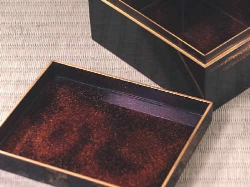 Rectangular black lacquer box decorated with gold and silver floral chrysanthemum motifs on the upper lid surface. View X