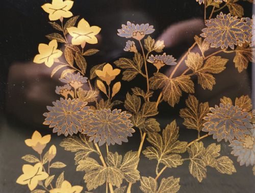 Rectangular black lacquer box decorated with gold and silver floral chrysanthemum motifs on the upper lid surface. View XII