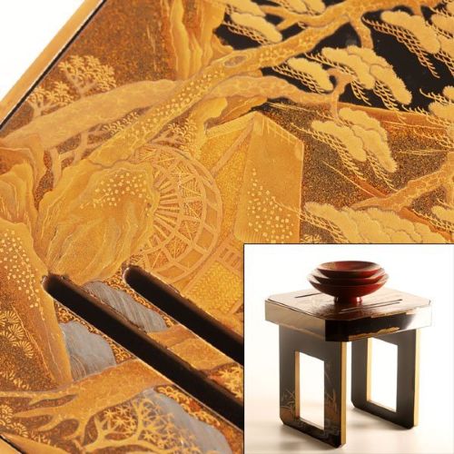 A Japanese black and gold lacquerware sake table featuring a raised stand, removable matching tray, and three red lacquer sakazuki cups adorned with painted gold motifs. View II