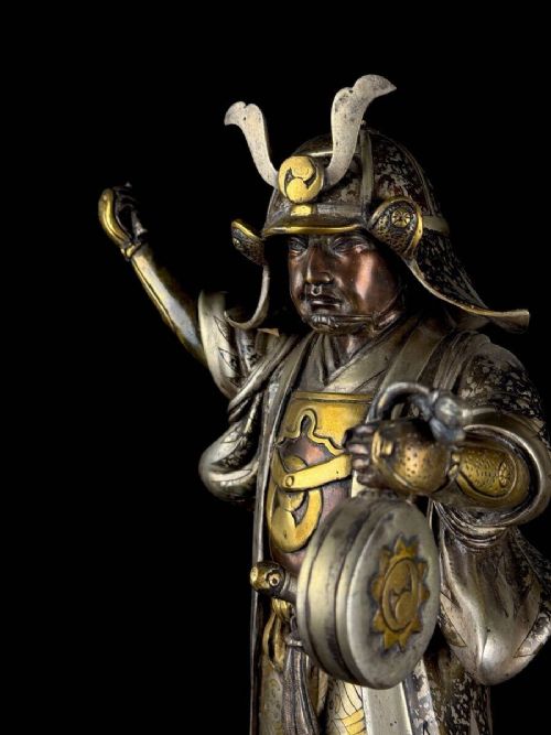 A late 19th-century Japanese bronze sculpture depicting samurai warrior Oishi Yoshio with gold and silver inlay detailing. View VI