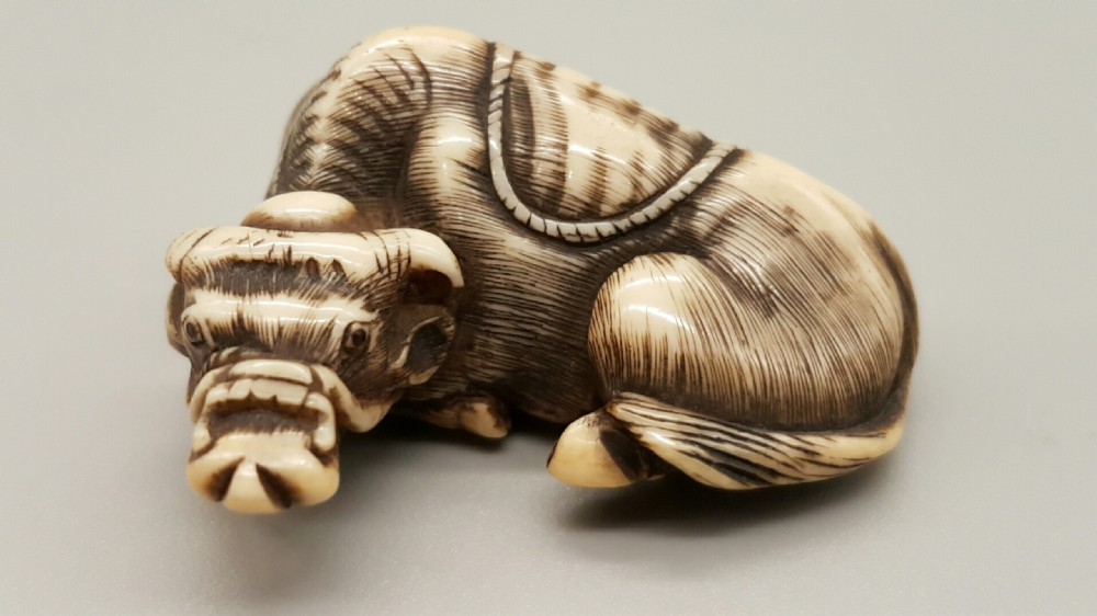Very good Japanese Meiji ivory netsuke of an ox signed Tomotada