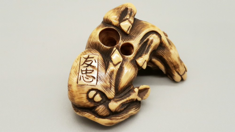 Very good Japanese Meiji ivory netsuke of an ox signed Tomotada View V