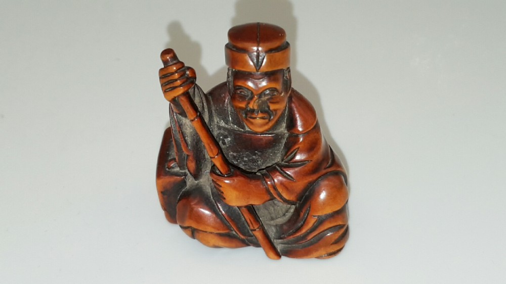 Japanese Meiji Boxwood Netsuke of Seated Figure with Staff