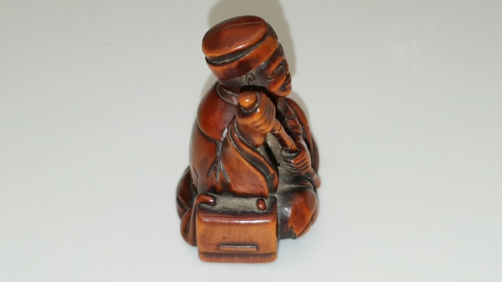 Japanese Meiji Boxwood Netsuke of Seated Figure with Staff View II