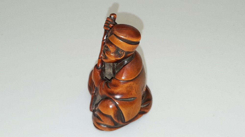 Japanese Meiji Boxwood Netsuke of Seated Figure with Staff View IV