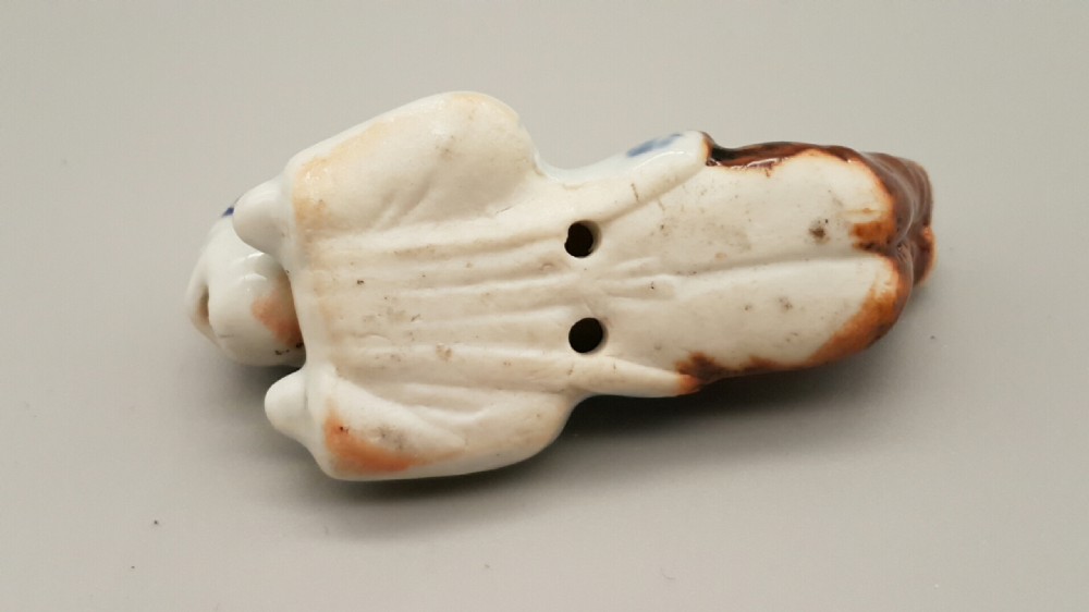 Japanese Meiji Hirado Porcelain Netsuke of a child with Moving Head & Tongue View IV