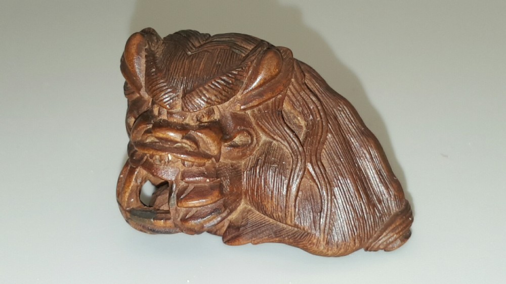 Japanese Meiji (19thC) Boxwood Netsuke of Shishi Guarding a Sacred Ball, signed Masayoshi View III