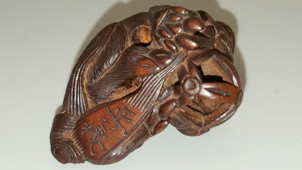 Japanese Meiji (19thC) Boxwood Netsuke of Shishi Guarding a Sacred Ball, signed Masayoshi View V