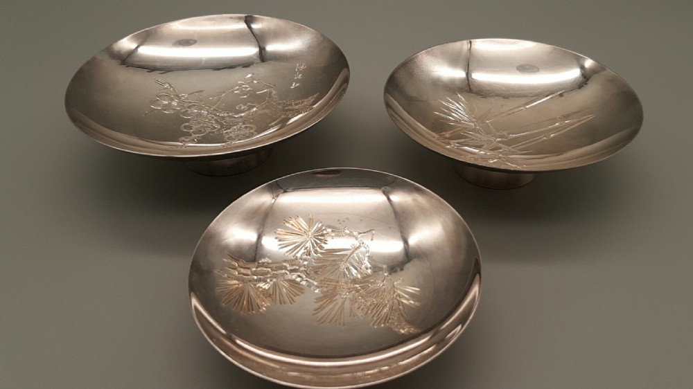 Japanese Meiji Set of Three Sterling Silver Sake Cups, signed Mitsukoshi
