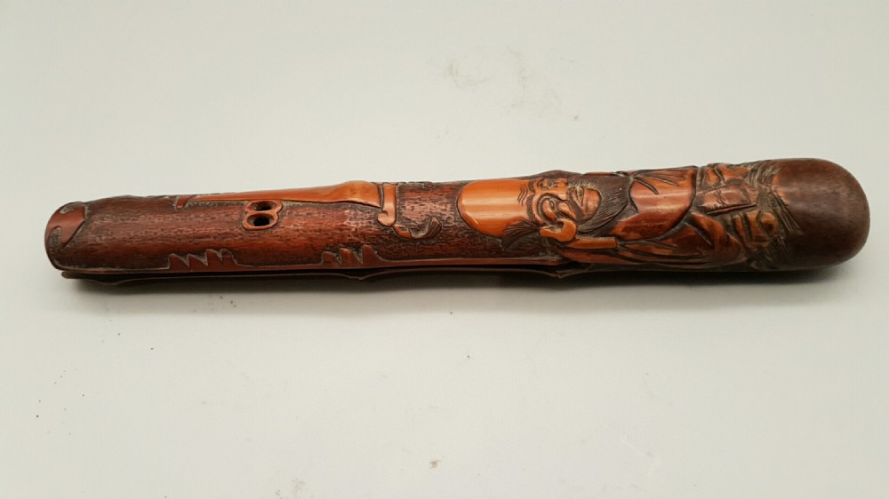 Japanese Meiji (19thC) Intricately Carved Wooden Pipecase (Kiseruzutsu) of Otoshi-Zutsu Form Depicting Fukurokuju View VI