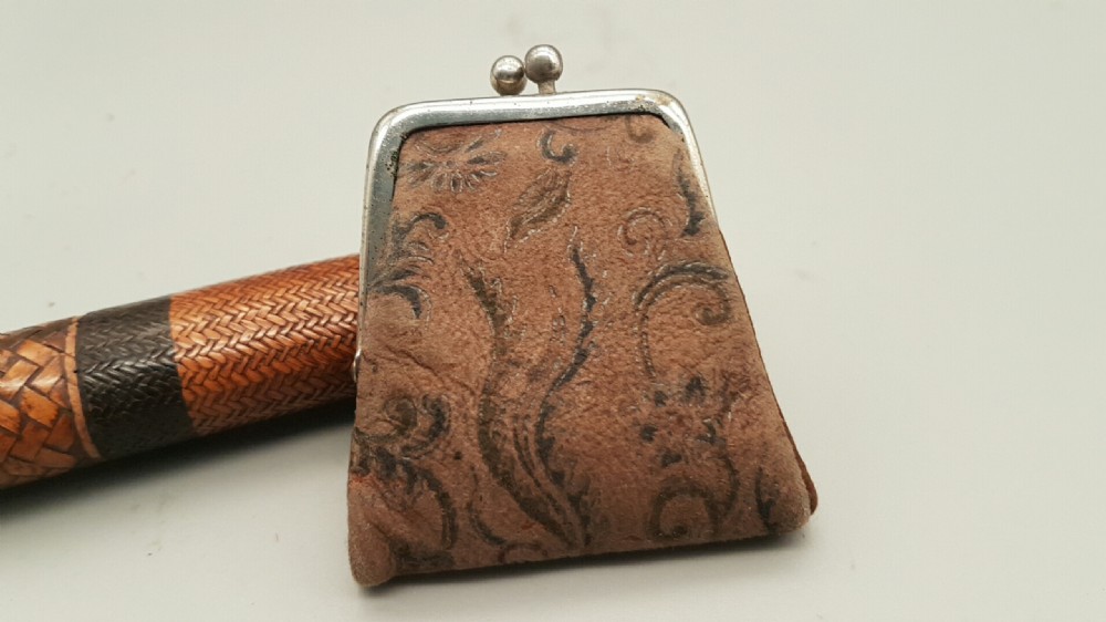 A Japanese woven bamboo pipe case with dark geometric weave bands paired with an attached pattern brocade purse. View V