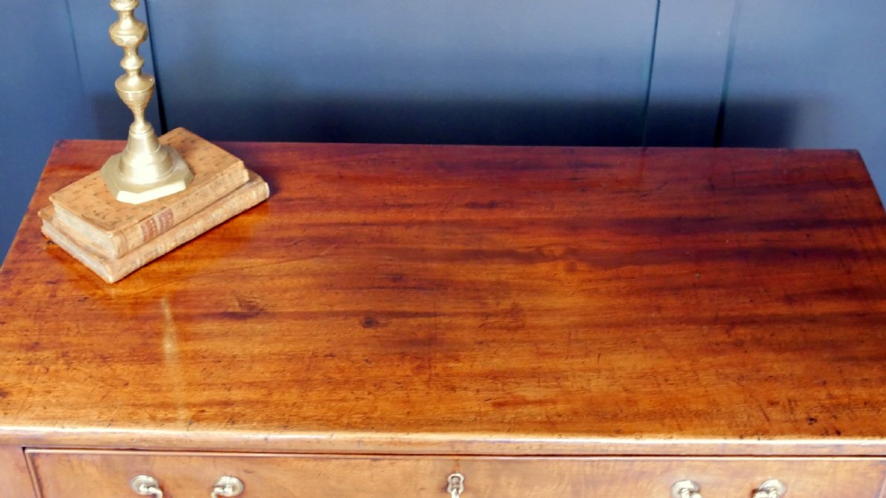 A George IV mahogany console table with a single frieze drawer, brass swan-neck handles, key tassel, and straight square legs. View VI