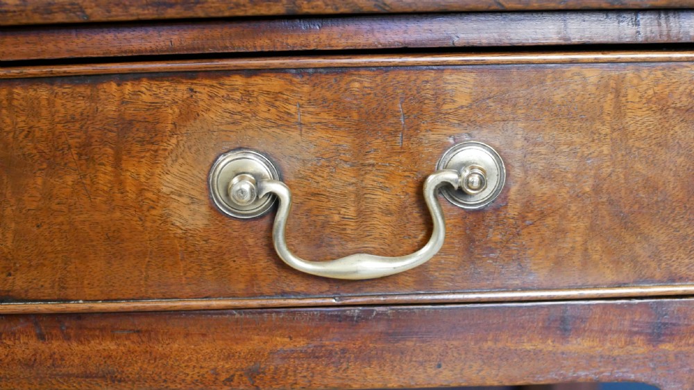 A George IV mahogany console table with a single frieze drawer, brass swan-neck handles, key tassel, and straight square legs. View VII