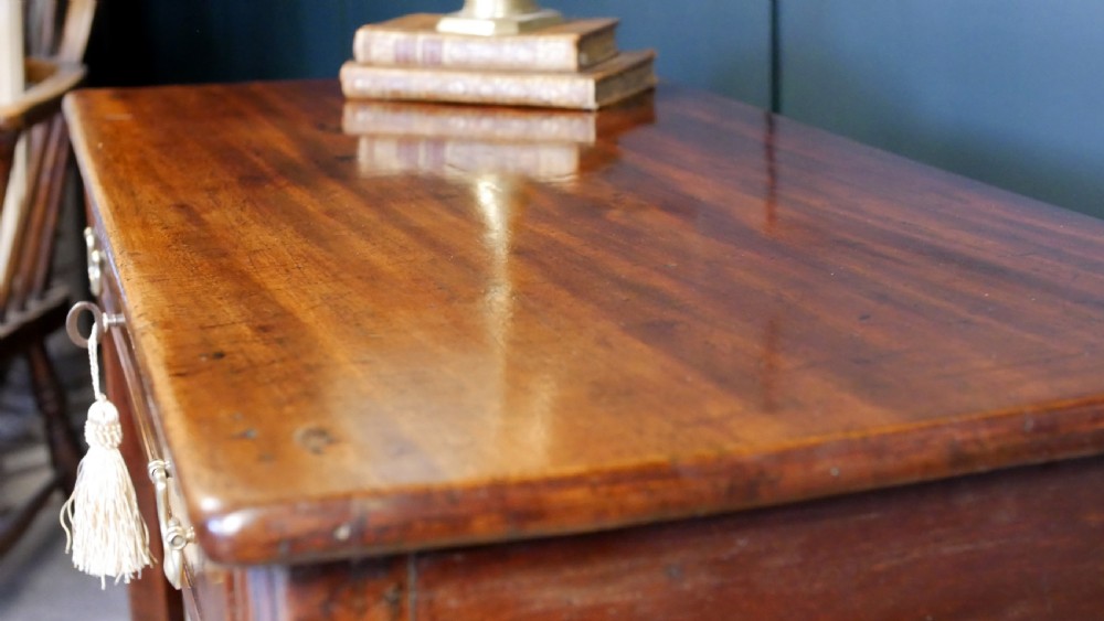 A George IV mahogany console table with a single frieze drawer, brass swan-neck handles, key tassel, and straight square legs. View XII