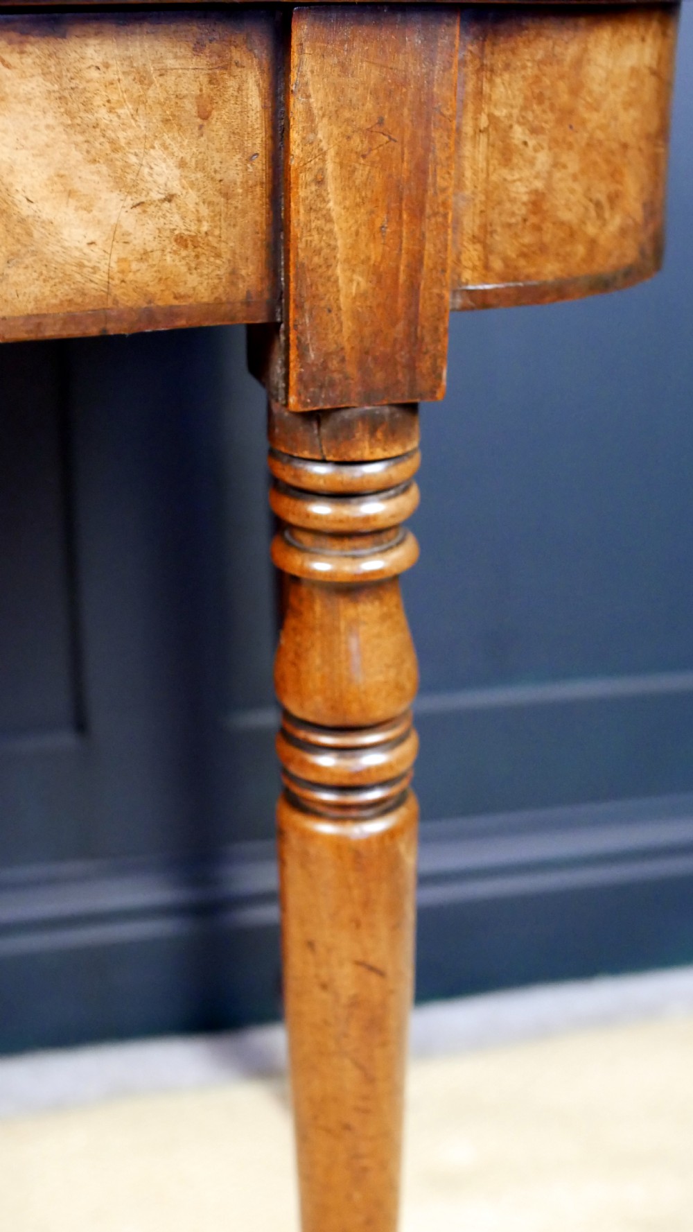 A Regency mahogany fold-over tea table featuring a rectangular hinged top with rounded corners, a deep frieze, and turned tapered legs. View XII