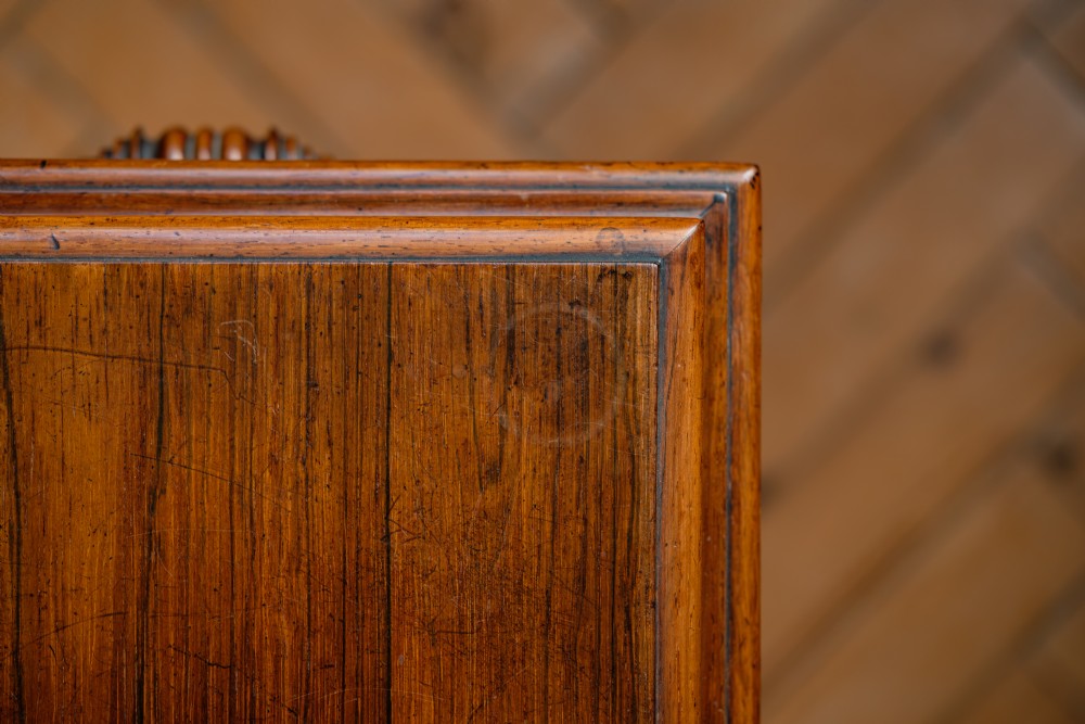 A Victorian rosewood teapoy featuring a rectangular hinged box top with a keyhole, supported by a tapered pedestal column on a four-pointed plinth base with scroll feet. View VIII
