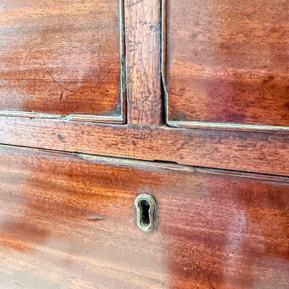 An antique mahogany chest of drawers with two short over three long drawers and floral inlay details along the upper frieze. View XI