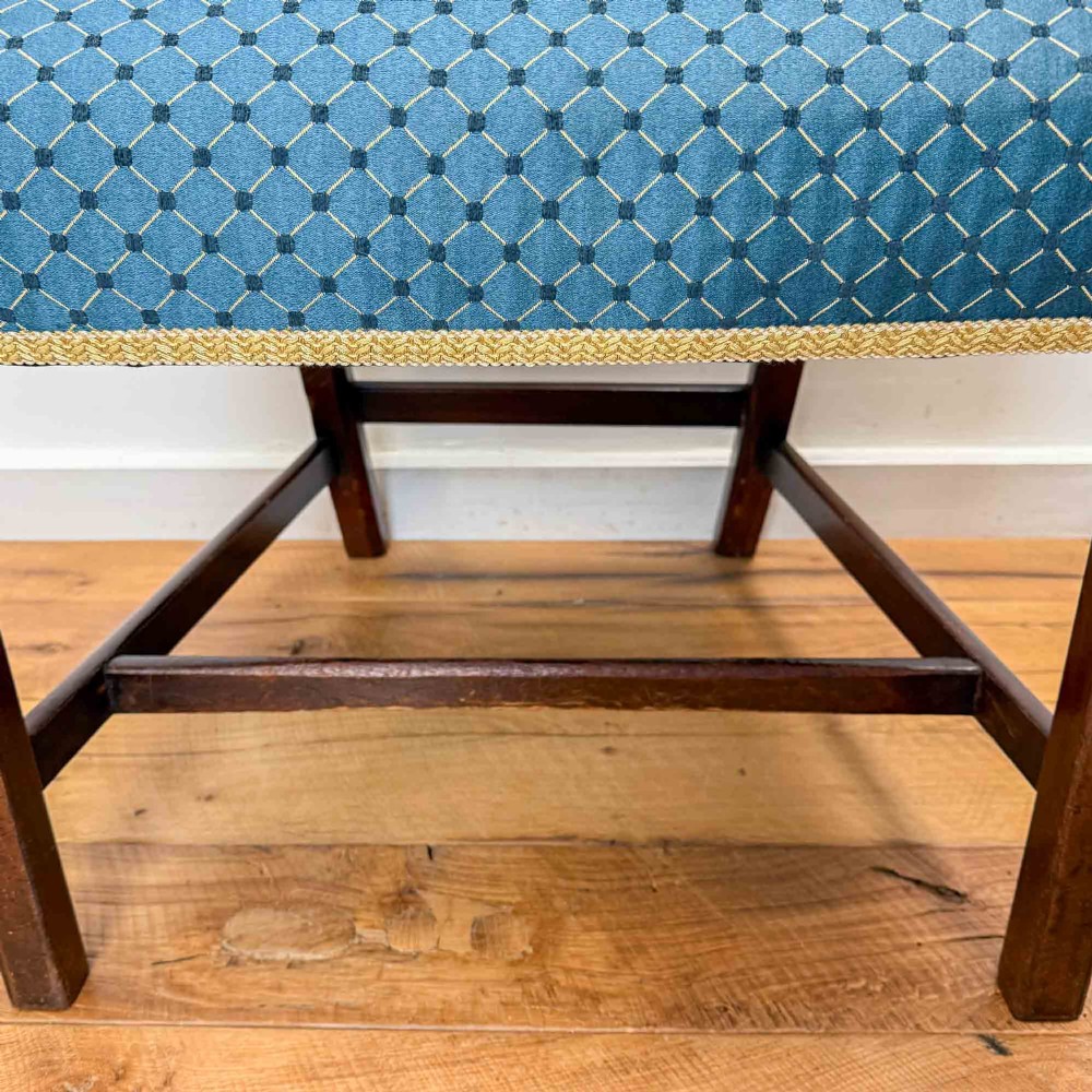 A pair of dark mahogany armchairs featuring carved pierced back splats, shaped arms, and blue patterned upholstered seats. View VII