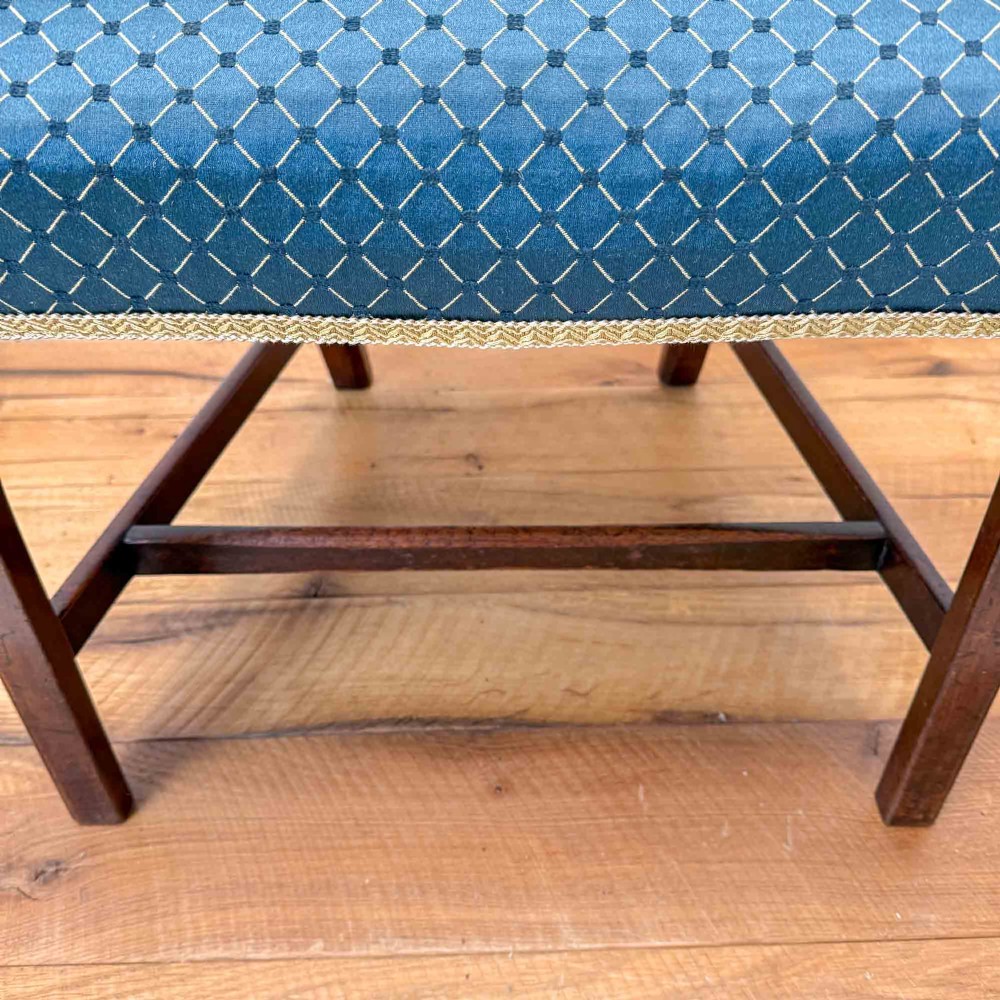 A pair of dark mahogany armchairs featuring carved pierced back splats, shaped arms, and blue patterned upholstered seats. View XIV