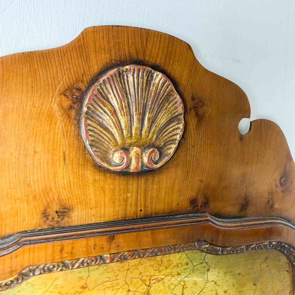 A tall Queen Anne Revival yew wood wall mirror featuring a carved shell crest at the top, an upper panel painted with a sailing ship maritime scene, and a rectangular glass mirror below. View IV