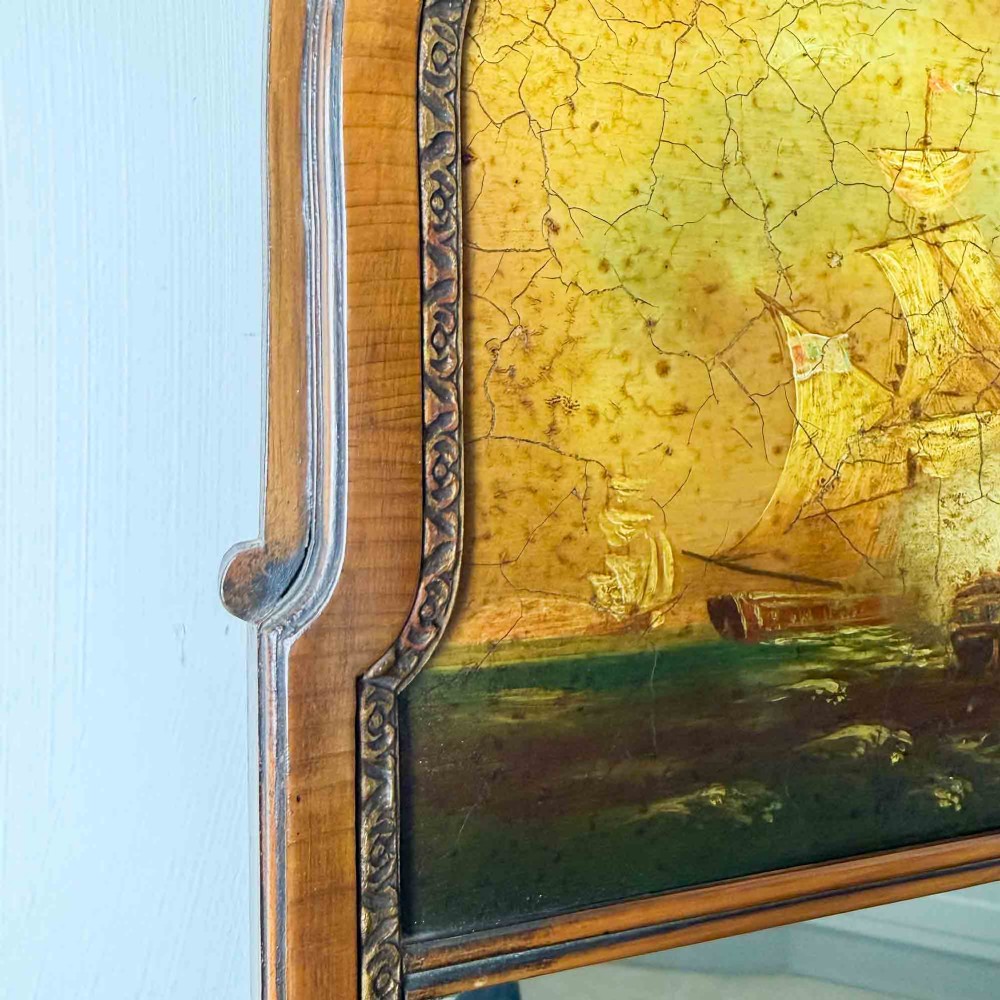 A tall Queen Anne Revival yew wood wall mirror featuring a carved shell crest at the top, an upper panel painted with a sailing ship maritime scene, and a rectangular glass mirror below. View V