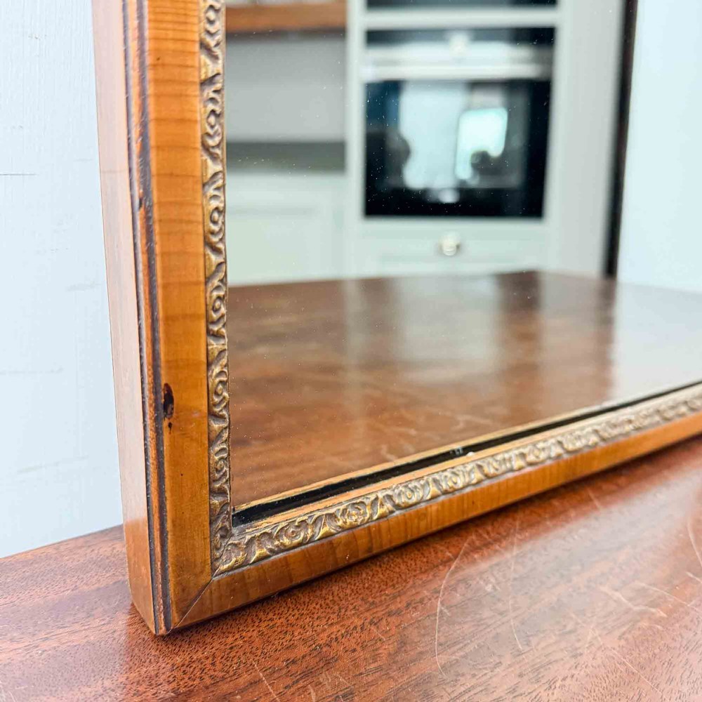 A tall Queen Anne Revival yew wood wall mirror featuring a carved shell crest at the top, an upper panel painted with a sailing ship maritime scene, and a rectangular glass mirror below. View VI