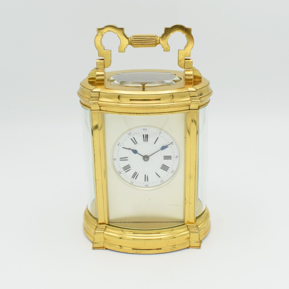 Very unusual Oval, repeating carriage clock 