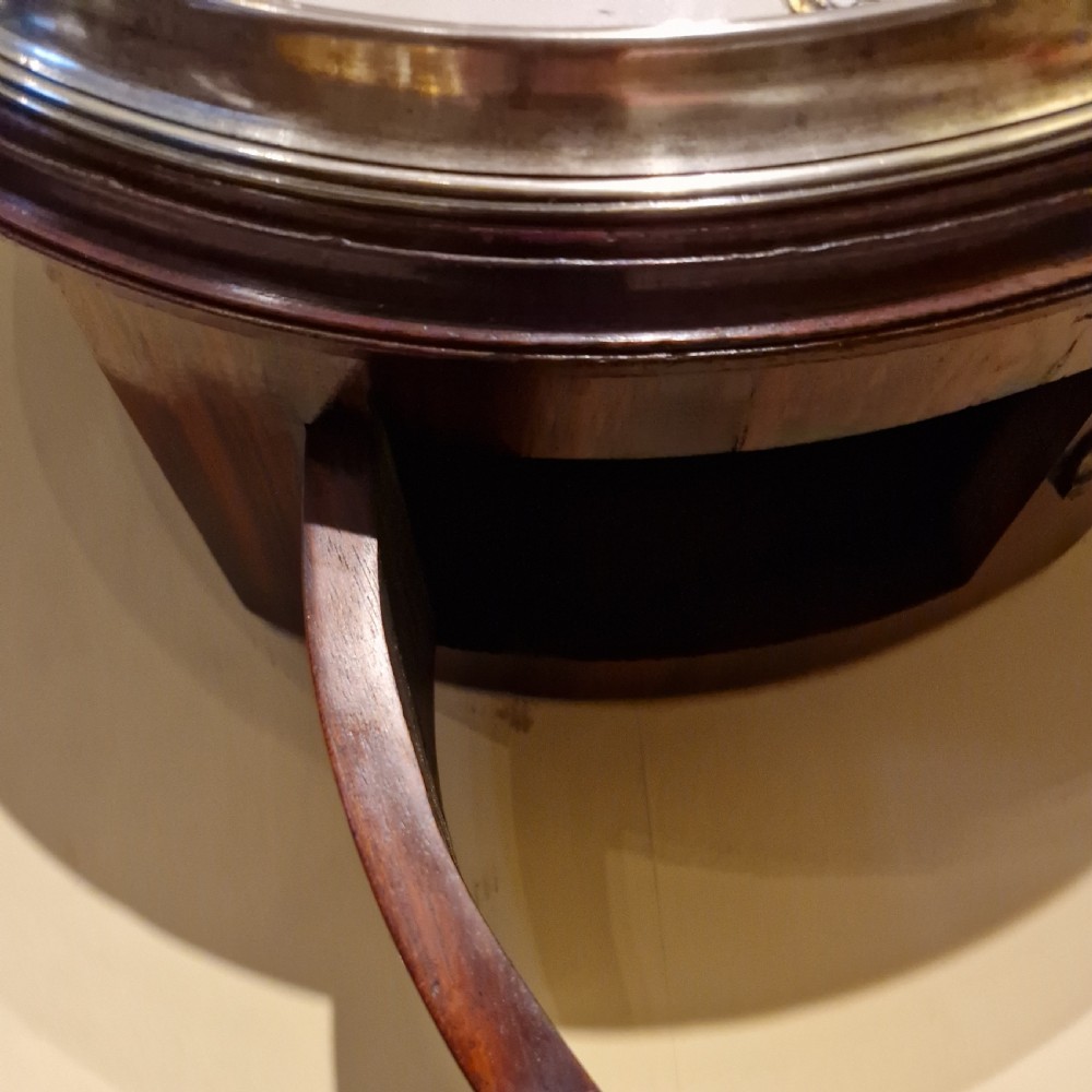 An antique circular fusee wall clock featuring a dark mahogany surround, brass bezel, and a white dial with Roman numerals signed Richd Clark Newport. View VII