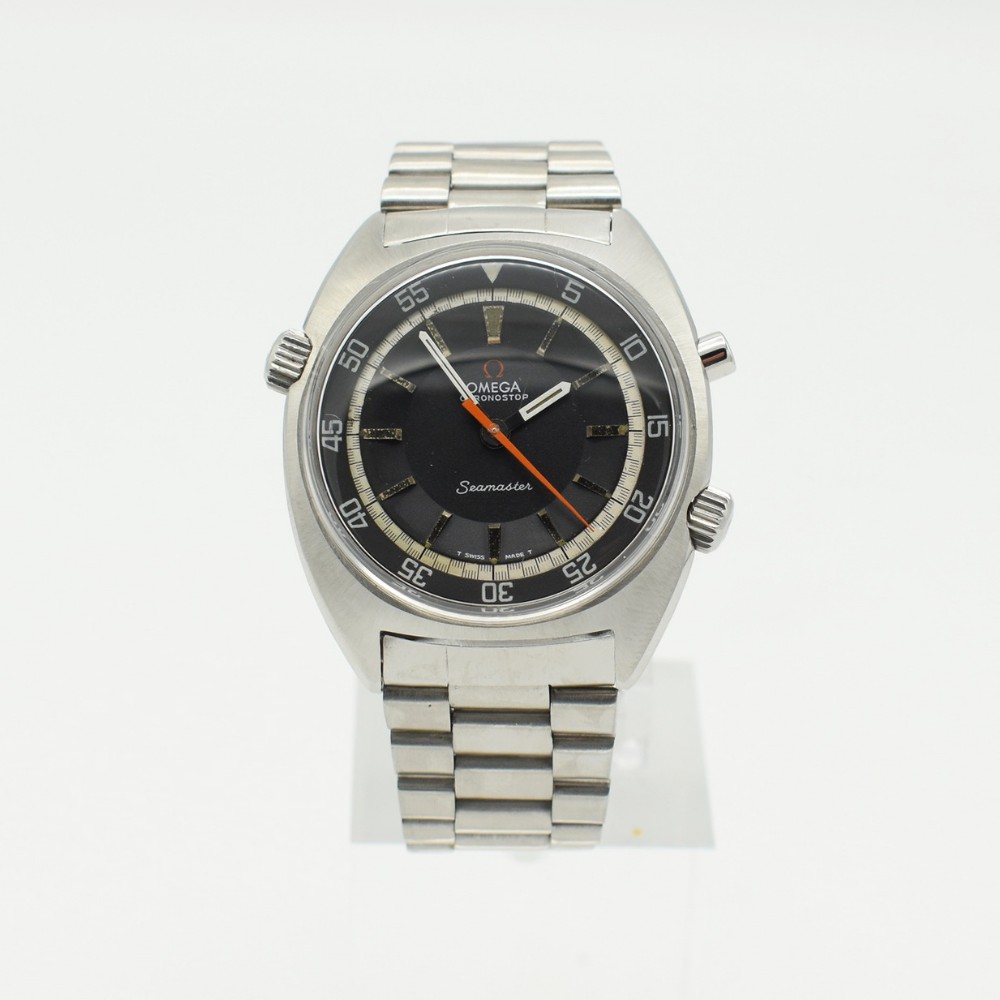A vintage Omega Seamaster Chronostop wristwatch with a stainless steel cushion case, black dial, orange central second hand, and black perforated leather strap.