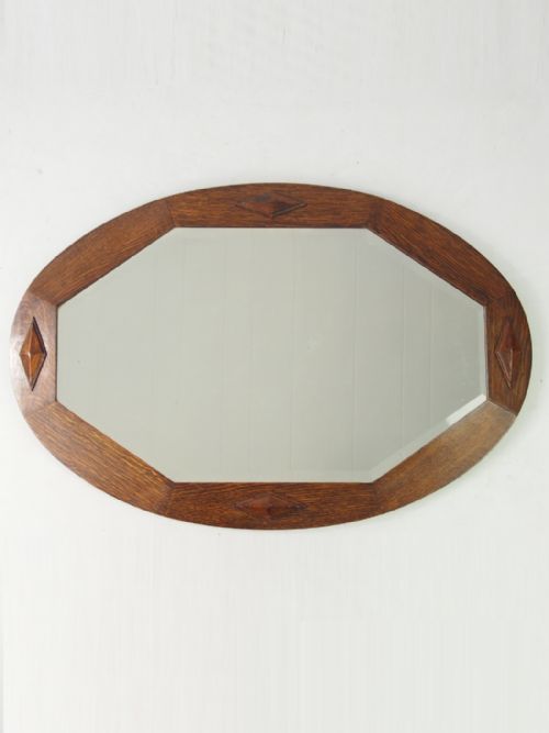 Hexagonal Mirror in an Oval Oak Frame