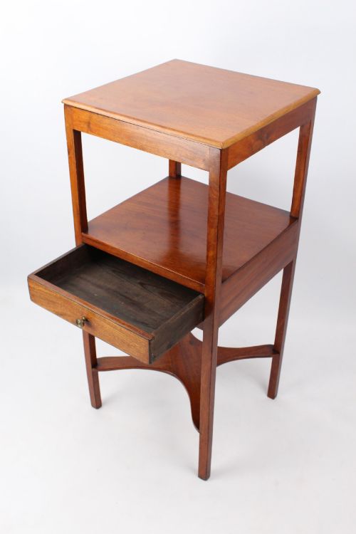 fig 1. A two-tier Georgian mahogany bedside table with a single drawer, square top, and curved X-form stretcher.
