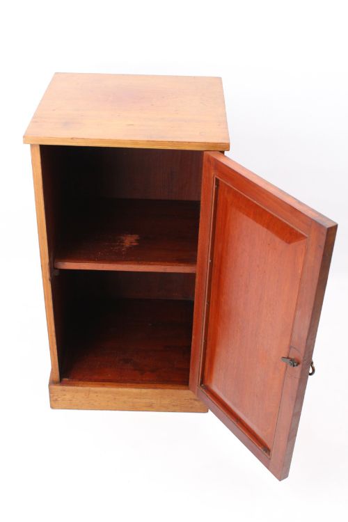 fig 1. A small Edwardian mahogany bedside cabinet featuring fine boxwood string inlay on the single cupboard door and a brass drop handle.